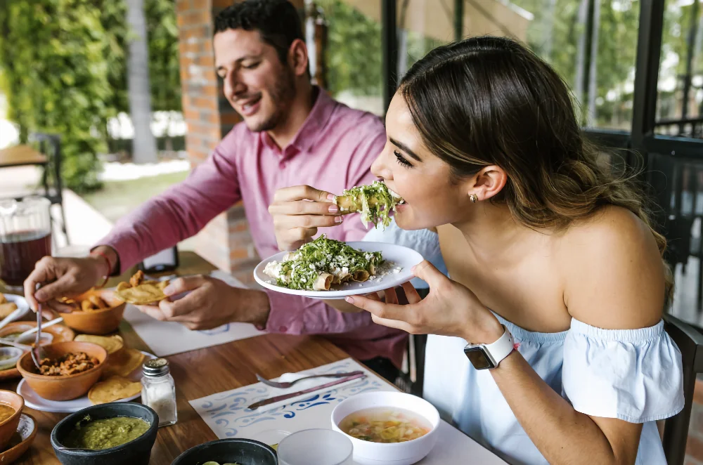 Two people eating a meal