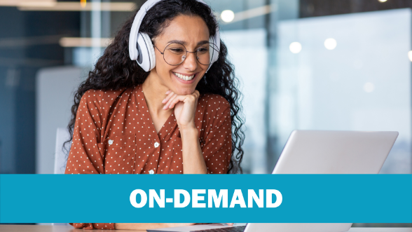 Smiling young woman wearing headphones using her laptop to engage in free professional learning for teachers on-demand.